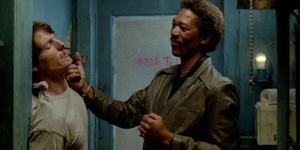 Morgan Freeman holds a gun to Christopher Reeve's face in the film Street Smart.