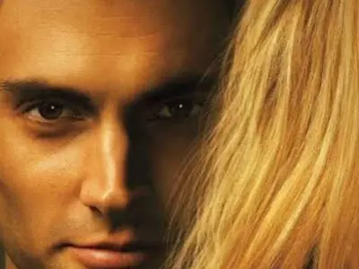 An AI-generated image of a man standing behind a woman, their faces in close-up.