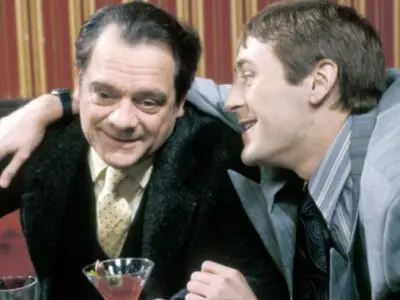 David Jason is smiling as a happy-looking Nicholas Lyndhurst puts his arm over his shoulders in the British TV sitcom Only Fools and Horses.