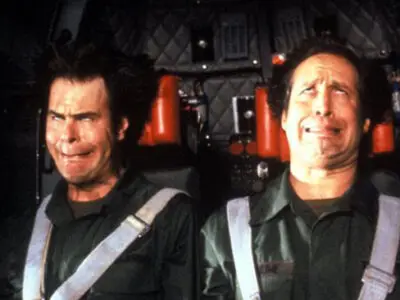 Dan Aykroyd and Chevy Chase experience strong G-forces, causing their faces to contort in an amusing way, in the film Spies Like Us.