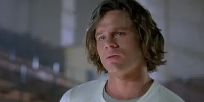 Richard Tyson, in mid-shot, sports mullet-length hair in the 1987 film, Three O'Clock High.