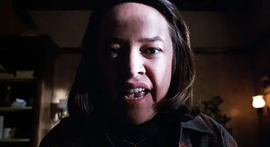 Kathy Bates is shown in close up, her face filling the screen as the sadistic Annie Wilkes in the film, Misery.