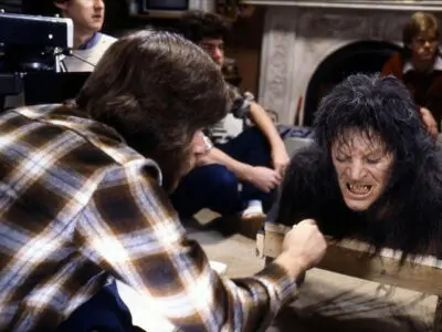 Behind the scenes on the film An American Werewolf in London with special effects make-up artist Rick Baker applying the finishing touches to the werewolf transformation make-up.