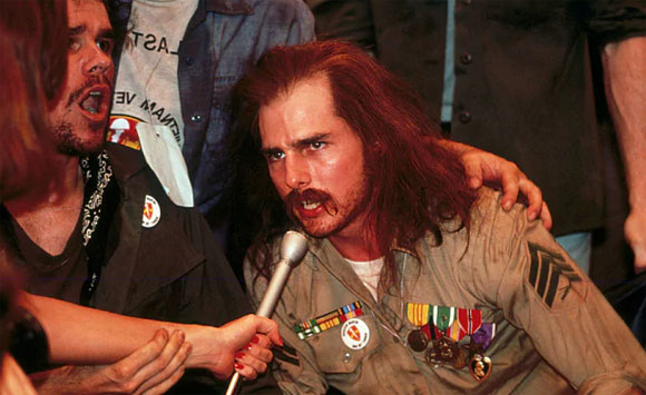 Tom Cruise is depicted in a wheelchair as an injured Vietnam War veteran in the film Born on the Fourth of July.
