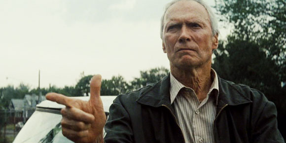 Clint Eastwood makes a faux gun symbol with his hand in the film Gran Torino.